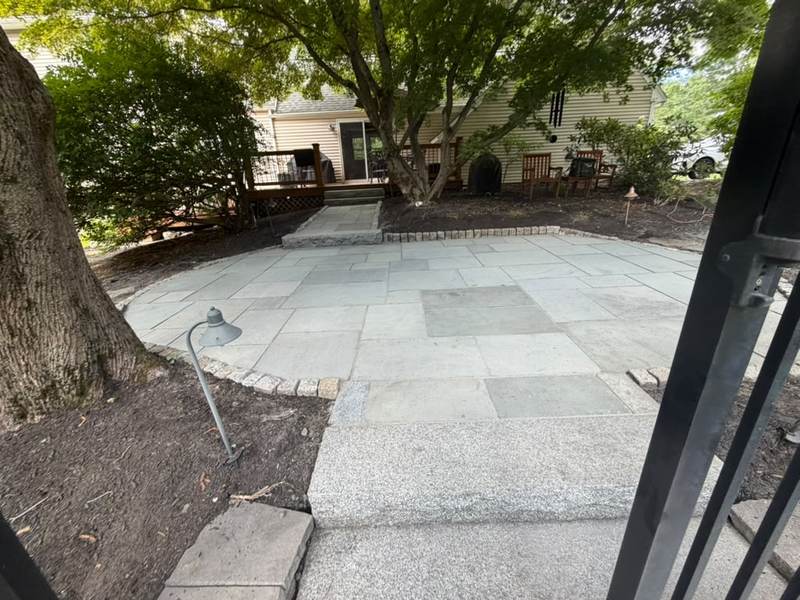 Bluestone patio set under mature trees